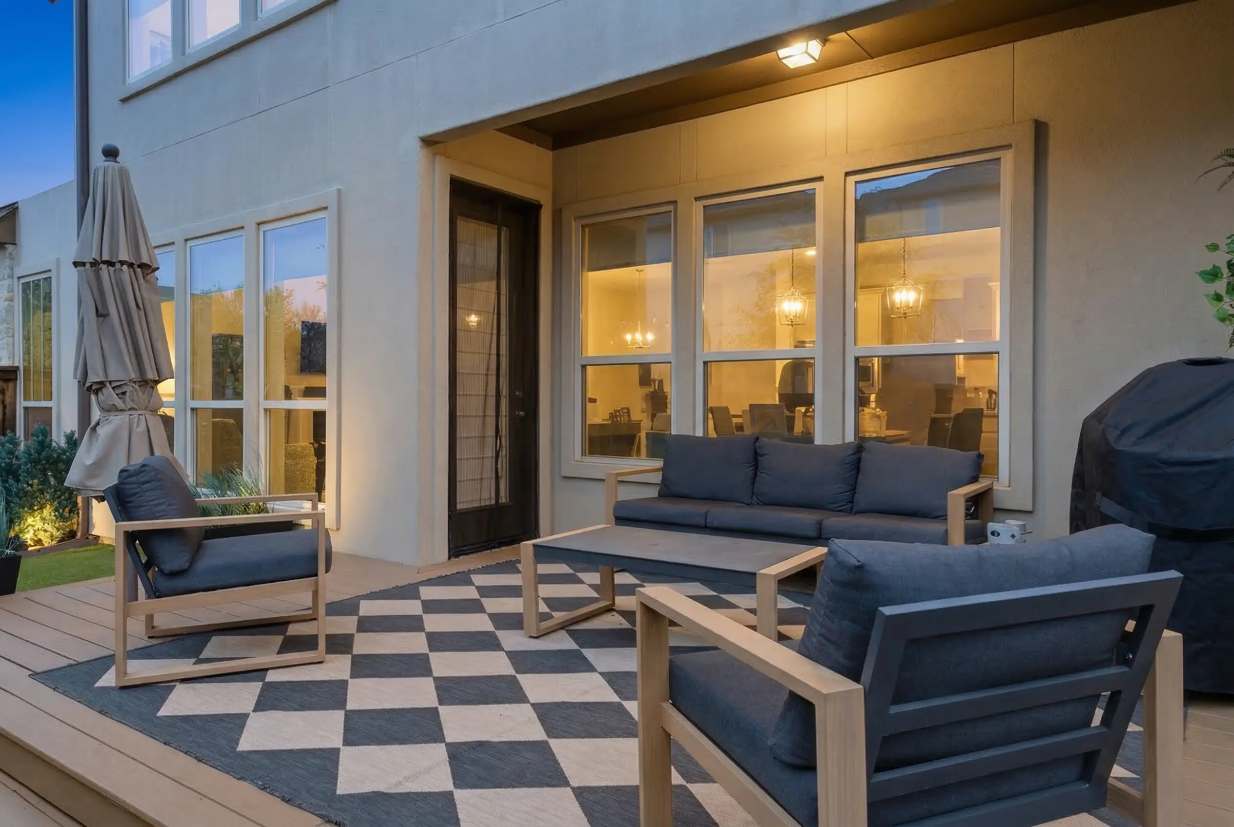 Outdoor seating area on deck with checkered rug