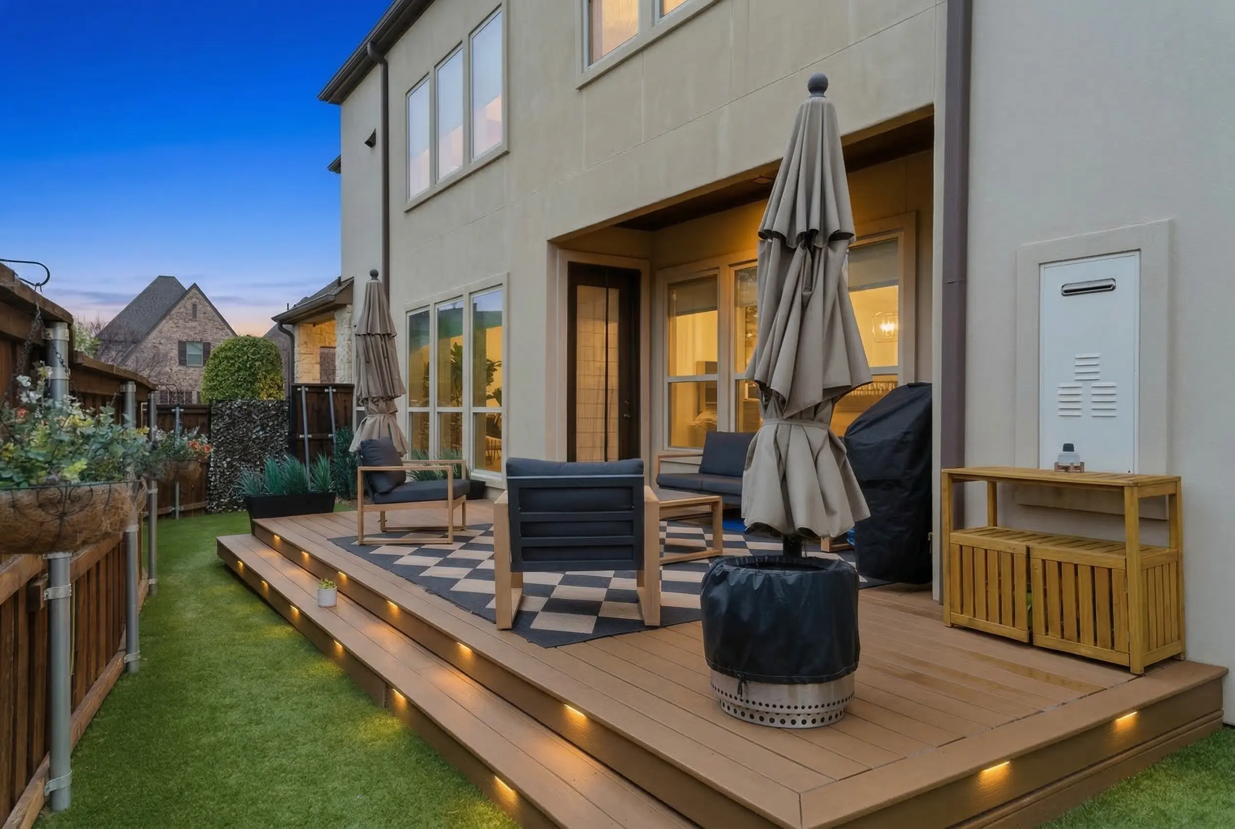 Composite deck with LED step lighting at twilight
