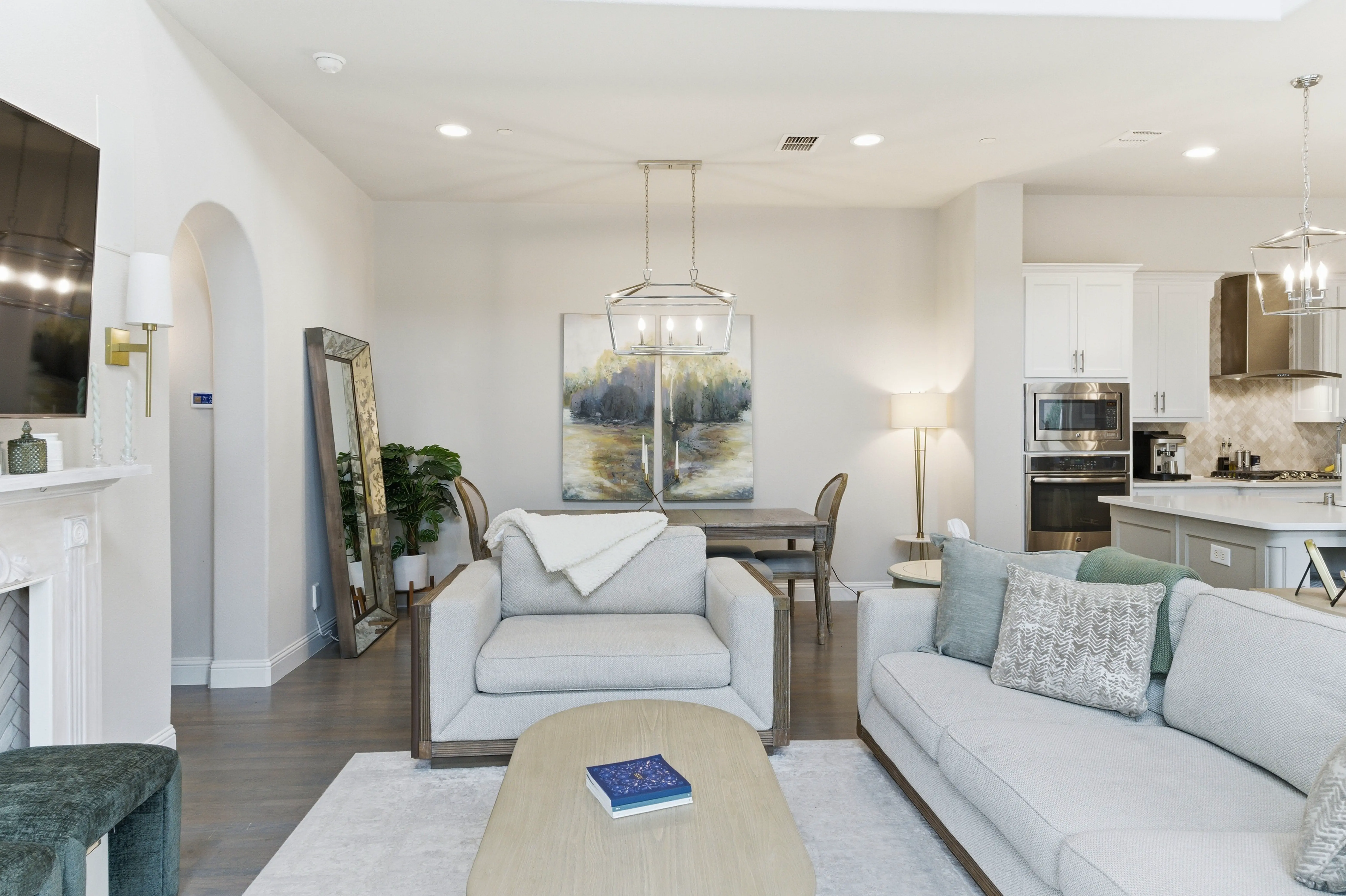 Living and dining area with open concept flow to kitchen