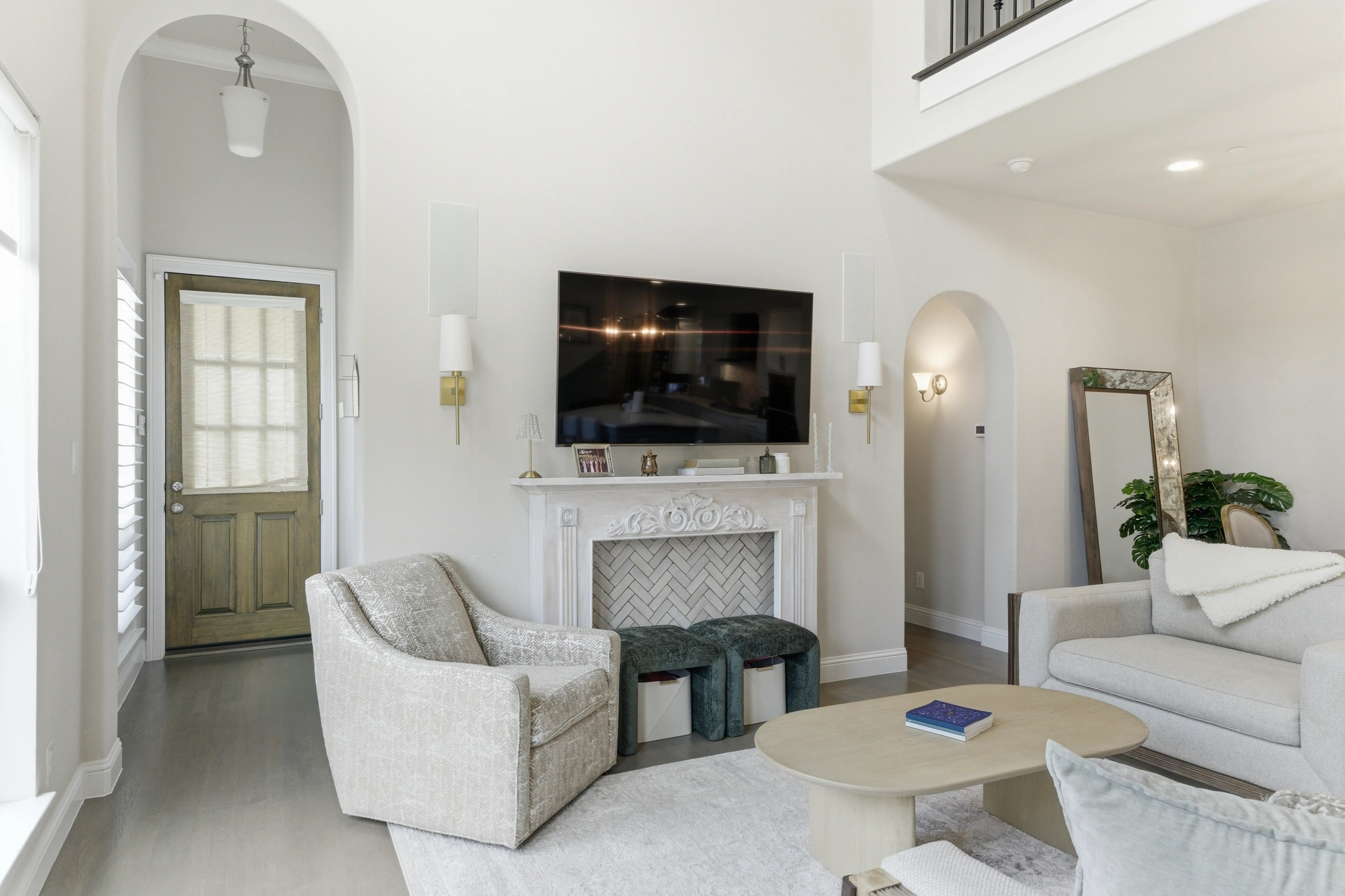 Living room with fireplace and arched doorways